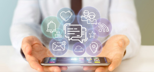 businessman holding a cloud of social media network icon
