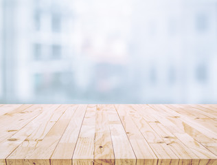 Wall Mural - Selective focus of wood table top on white wall glass (big window) background