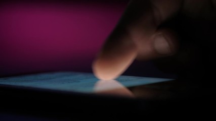 Wall Mural - Male index touching and scrolling a phone screen with texts and pictures