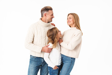 Poster - Image of caucasian family in winter clothes hugging together and smiling