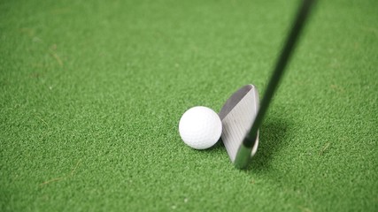 Wall Mural - Image of golf iron and golf ball on green grass