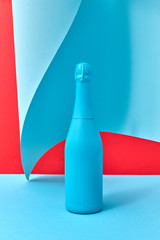 Wall Mural - Decorative painted blue wine bottle mock up on a duotone wavy background.