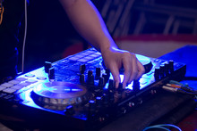 Sound Engineer On Mixer, Close Up Of DJ Hands On Stage Mixing, Disc Jockey And Mix Tracks On Sound Mixer Controller, Playing Music At Bar, Disco Tech Or Night Club Party. 