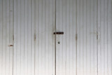 Fototapeta Dmuchawce - old wooden door with lock