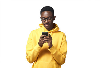 Wall Mural - young black man in yellow hoodie with phone
