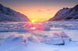 Frozen fjord in northern Norway in winter at sunrise