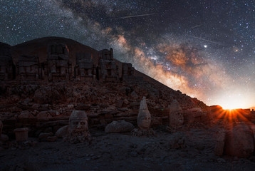 Wall Mural - ancient statues on the nemrut mountain on the beautiful. milky way galaxy. unesco heritage. nemrut, 