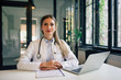 © bnenin - Portrait of a confident doctor at work in medical office.