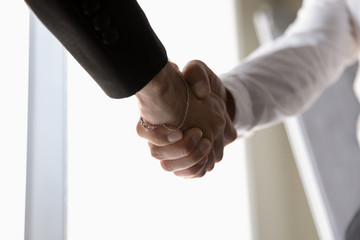 Sticker - Businessmen handshake greeting or closing deal at meeting