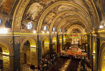 Beautiful interior of the 16th century St John's Co-Cathedral, with frescoes inside Roman Catholic church. Valletta, Malta.