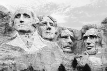 A Closeup Of The Four Heads Of USA Presidents At Mount Rushmore South Dakota In Black And White