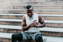 A 31 Year Old African American Man With Black Skin He Is And Athlete, He Is Having Pain In The Chest Due To Heart Disease, After He Exercised By Running Up And Down The Stairs, To Health Care Concept.