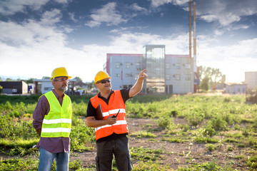 Engineers,oil workers at industrial facility