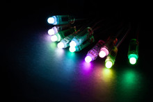 Glowing RGB Led Pixels Christmas Holiday Lights On Black Background.