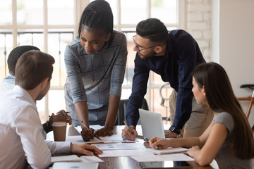 diverse group of managers working together at office.