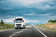 White Truck Or Traction Unit In Motion On Road, Freeway. Asphalt Motorway Highway Against Background Of Mountains Landscape. Business Transportation, Trucking Industry