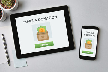 donate concept on tablet and smartphone screen