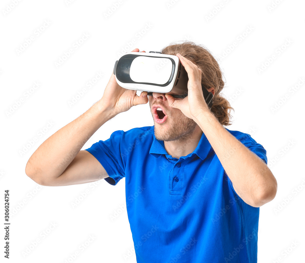 Young man with VR glasses on white background