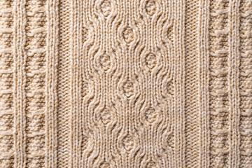 Beige Knitwear Fabric Texture with Pigtails. Beige Knitted Background.