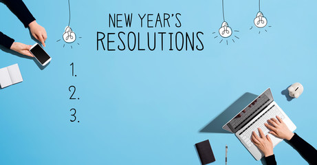 Canvas Print - New years resolution with people working together with laptop and phone