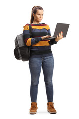 Sticker - Female student standing and using a laptop