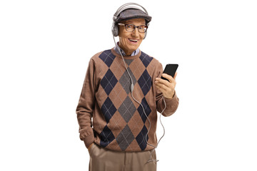 Canvas Print - Senior man listening to music on headphone from a mobile phone