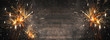 © Corri Seizinger - Sylvester 2025, New Year's Eve,  New Year background panorama long - Firework Fireworks on rustic brown wooden wood texture