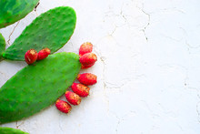 Ripe Fruits Of Prickly Pear (Opuntia) At A White Wall.