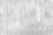 © Ekkachai - Concrete wall white grey color for background. Old grunge textures with scratches and cracks. White painted cement wall texture.