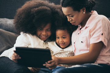 Wall Mural - african american family at home, mom and children