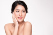© kitthanes - Beautiful young Asian woman touching soft cheek and smile with clean and fresh skin. Happiness and cheerful with, on white background, Beauty and Cosmetics Concept,