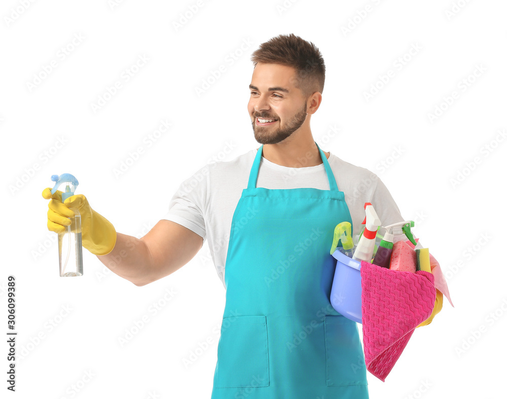Male janitor with cleaning supplies on white background