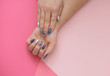 © Jane_S - Beautiful stylish female manicure on a pink background.