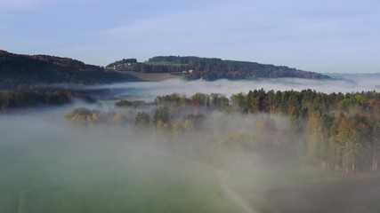 Wall Mural - Aerial view of the Swiss Midland on an autumn morning with fog near Buchs, Lucerne