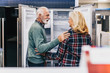 © hedgehog94 - Senior husband and wife, satisfied customers choosing fridges in appliances store.