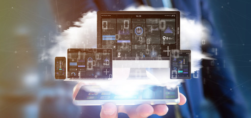 Poster - Businessman holding Devices connected to a cloud multimedia network 3d rendering