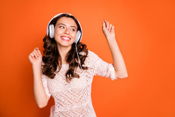Wall Mural - portrait of charming cute girl listen music on her modern headset like playlist dance wear good look
