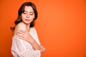 Wall Mural - Close up photo of elegant charismatic girl lady visit luxury party want attract rich millionaire touch her shoulder palm hug herself off-shoulders blouse isolated over orange color background