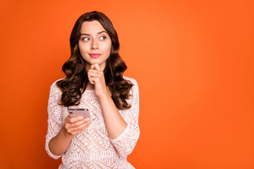 Wall Mural - portrait of minded girl blogger use smart phone think thoughts what type touch finger chin look copy