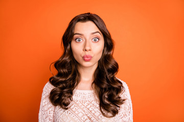Wall Mural - Portrait of funny funky girl youth stare in camera send air kisses wear knitted blouse isolated over vibrant color background
