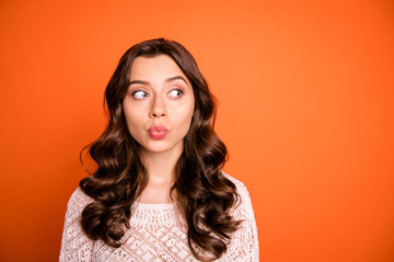 Wall Mural - Portrait of funny funky pretty girl look copy space watch boyfriends want send air kiss on holidays wear white feminine outfit isolated over orange color background
