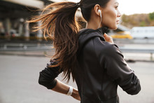 Strong Fitness Woman Running Outdoors By Street.