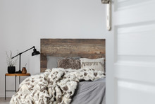 Open Door To Grey Elegant Bedroom Interior With Rustic Design, Copy Space On Empty Wall