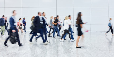 Anonymous crowd of business people at trade fair