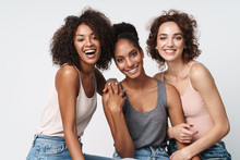 Portrait Of Gorgeous Multiracial Women Standing Together And Smiling