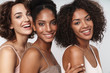 Portrait of charming multiethnic women standing together and smiling