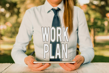 Fototapete - Writing note showing Work Plan. Business concept for project to be accomplished and outlines how it will be done Female business person sitting by table and holding mobile phone