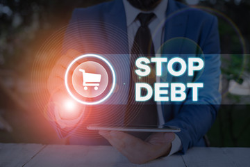 Word writing text Stop Debt. Business photo showcasing does not owning any money or things to any individual or companies