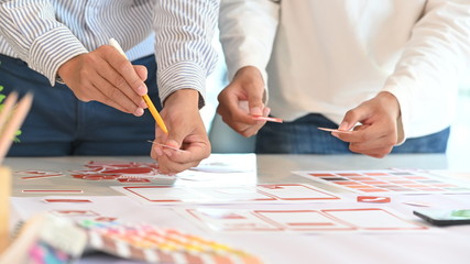 ux ui concept, closeup team of development software mobile working with design workspace.