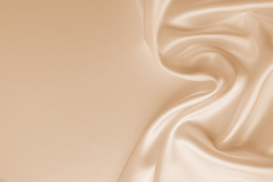 Wall Mural - Beautiful smooth elegant wavy beige / light brown satin silk luxury cloth fabric texture, abstract background design. Copy space. Card or banner